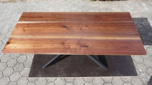 Noble walnut dining table handcrafted by Patrick Herrmann tablemanufacturer for one-of-a-kind tables with own lumberyard in Stuttgart-germany