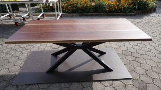 Walnut dining table from Patrick Herrmann table manufacturer for one-of-a-kind tables and counters with own lumberyard in Stuttgart-germany